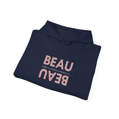 A folded navy blue BEAU graphic hoodie with a mirrored dusty pink BEAU print and CHTQ Design detail on the chest, displayed against a white background.