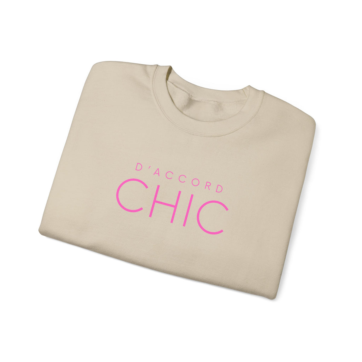 Folded Sand D’Accord Chic graphic crewneck sweatshirt with pink typography on the front, shown against a white background.