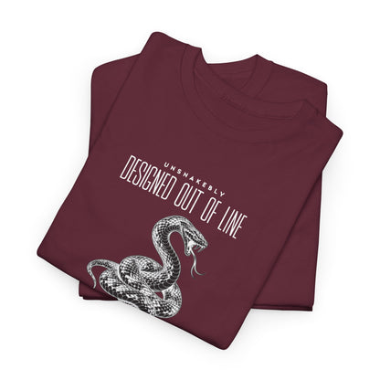 Folded burgundy UNSNAKEBLY graphic T-shirt showing the snake illustration and printed typography.