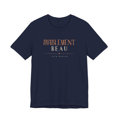 A nav short-sleeve crewneck t-shirt with a graphic on the chest reading 'DIABLEMENT BEAU' in a warm brown/bronze color, with 'CHtq DESIGN' printed below in smaller text, shown on a plain white background.