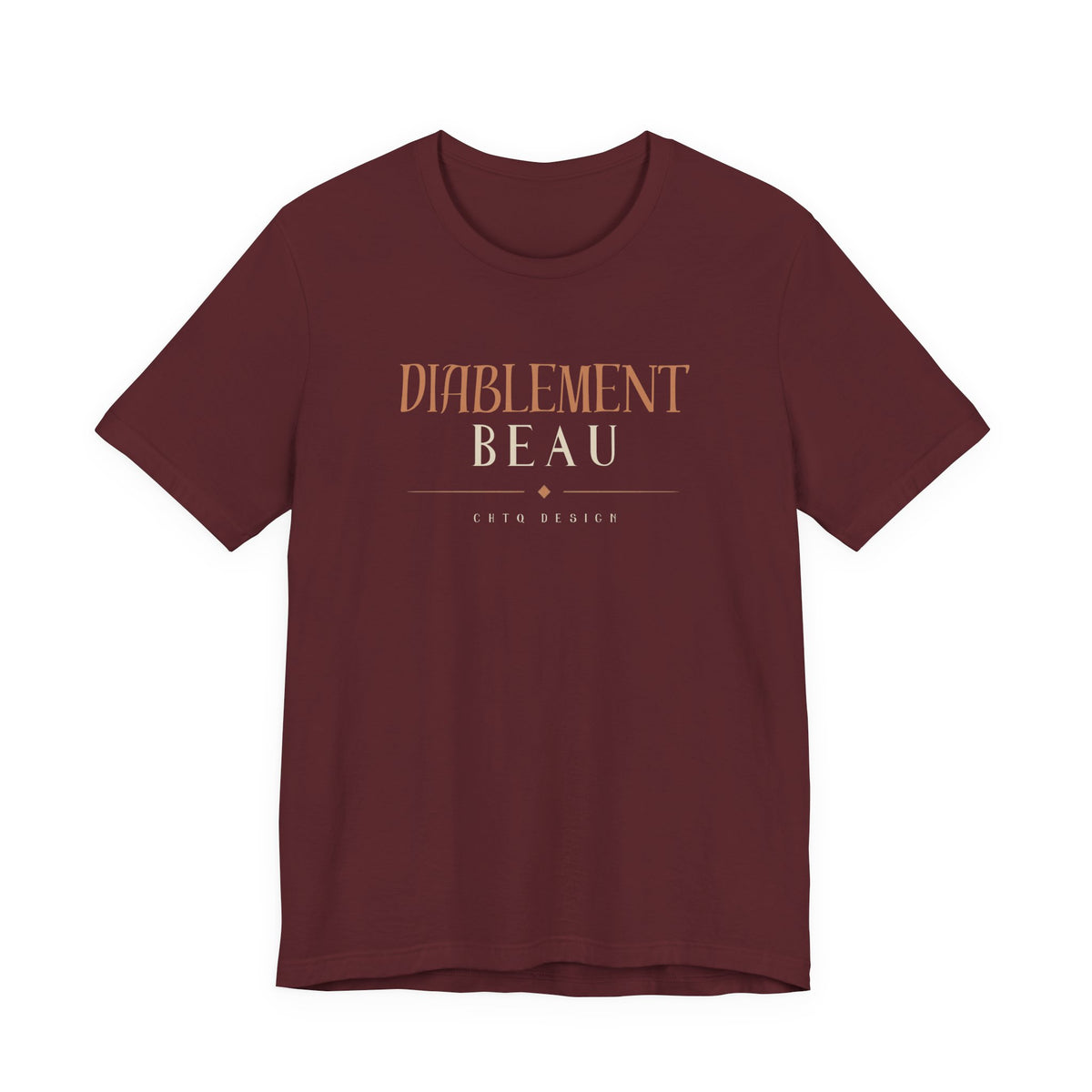 A short-sleeve crewneck t-shirt in maroon with a graphic print on the chest reading 'DIABLEMENT BEAU' and 'Chtq DESIGN' in a warm tan color, displayed against a solid white background.