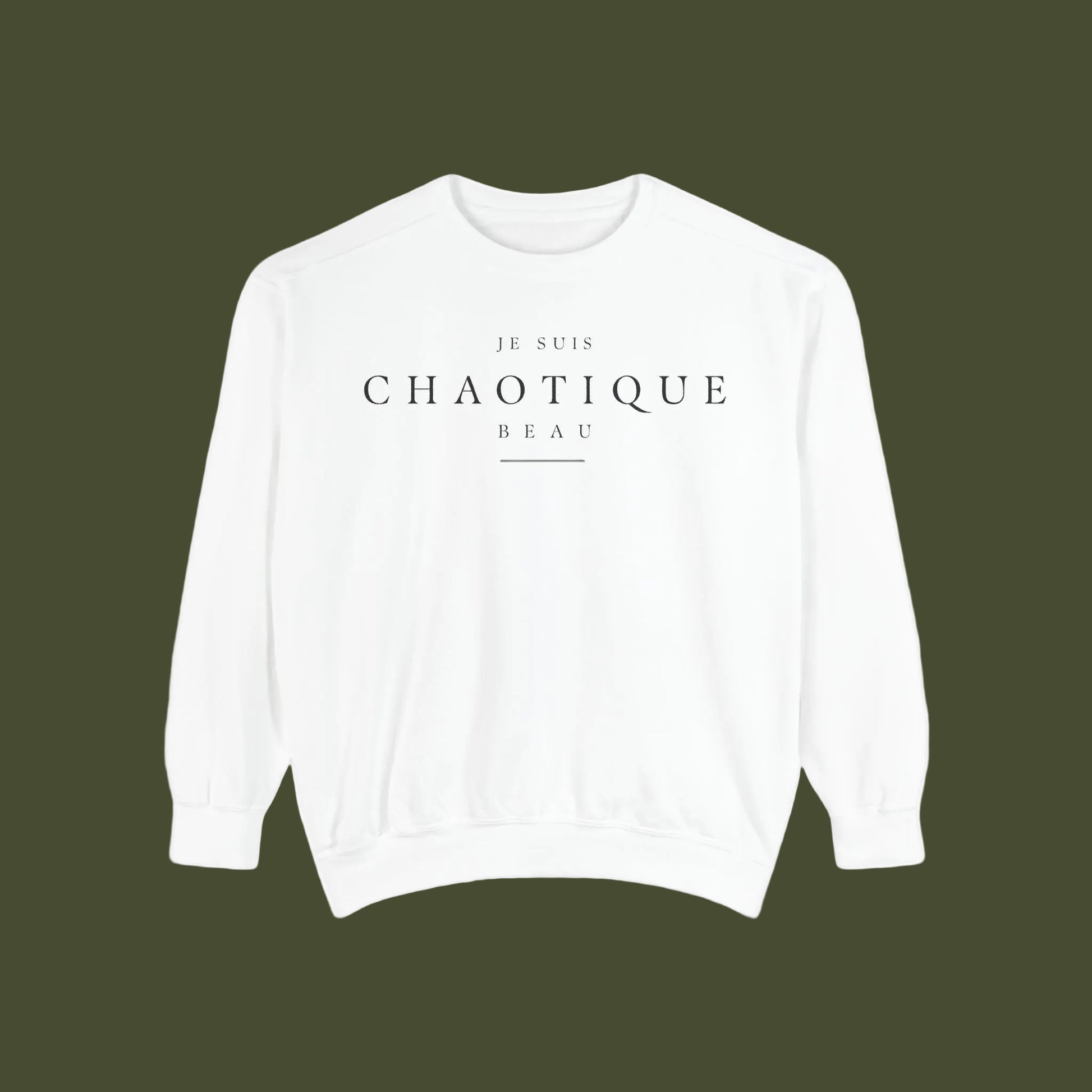 A white crewneck sweatshirt with black printed text reading 'JE SUIS CHAOTIQUE BEAU' on the chest, displayed against a solid white background.