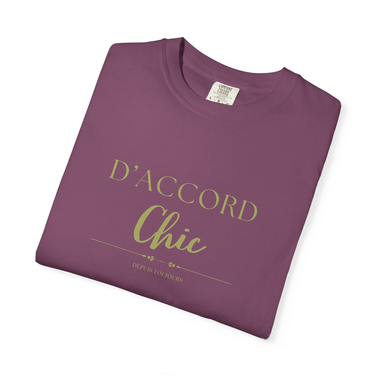 Folded purple t-shirt with a graphic text D'accord chic depuis toujours