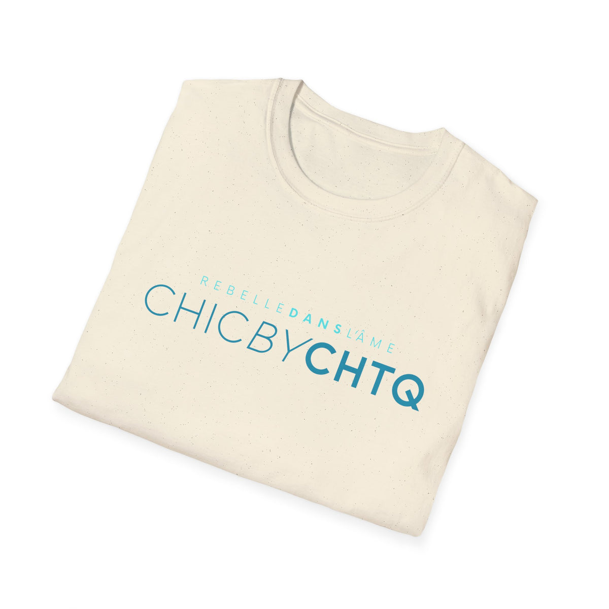 A beige short-sleeve crewneck T-shirt featuring turquoise “CHIC BY CHTQ” text with “REBELLE DANS L’ÂME” above, displayed against a clean white background.