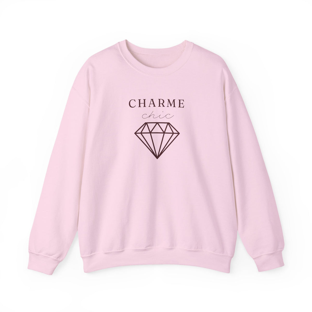A light pink crewneck sweatshirt featuring a black graphic print on the front with the text 'CHARME chic' and a diamond illustration, displayed on a clean white background.