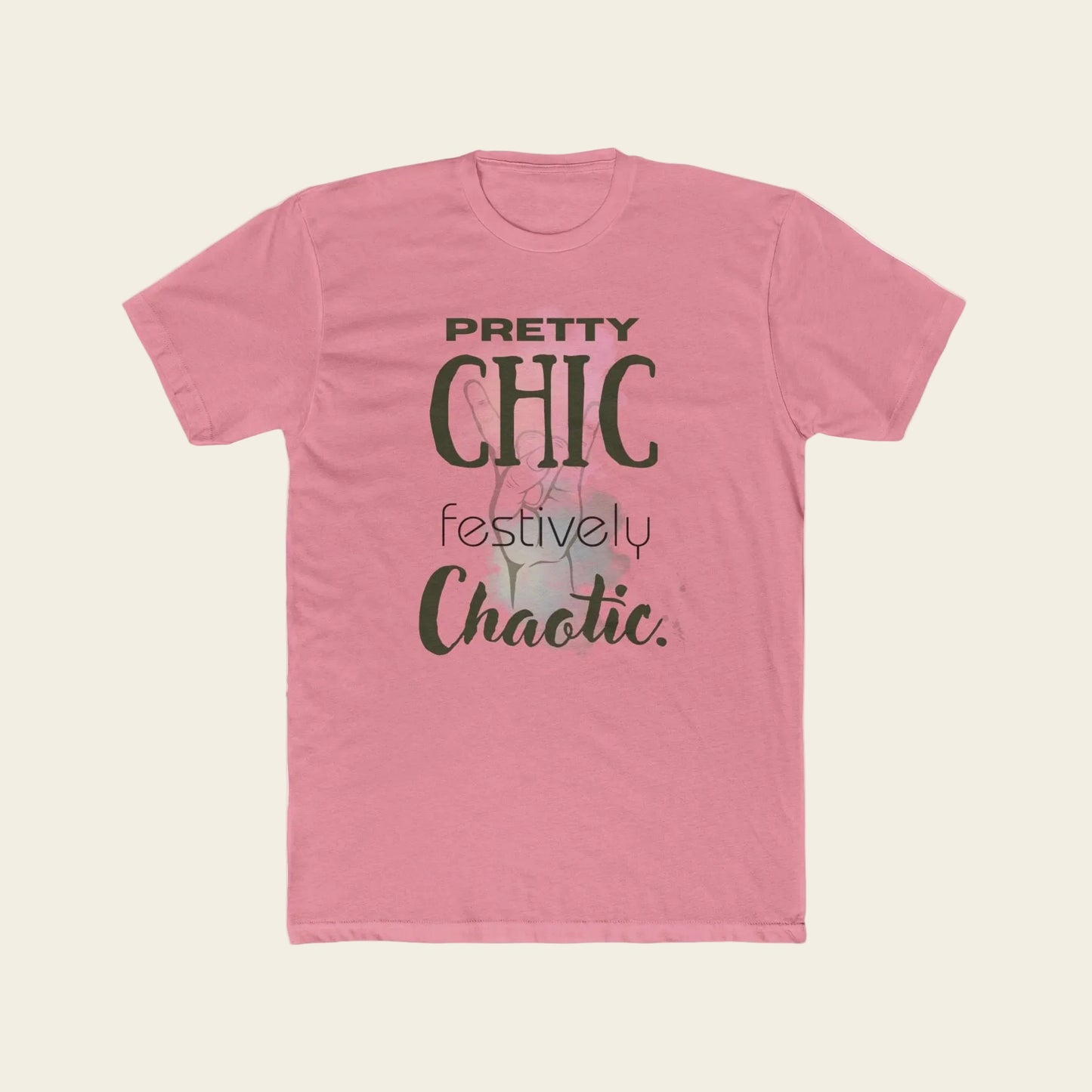 A pink short-sleeve crewneck t-shirt with a graphic text print reading 'PRETTY CHIC festively Chaotic.' in dark green and gray lettering, displayed on a solid white background.