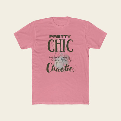A pink short-sleeve crewneck t-shirt with a graphic text print reading 'PRETTY CHIC festively Chaotic.' in dark green and gray lettering, displayed on a solid white background.