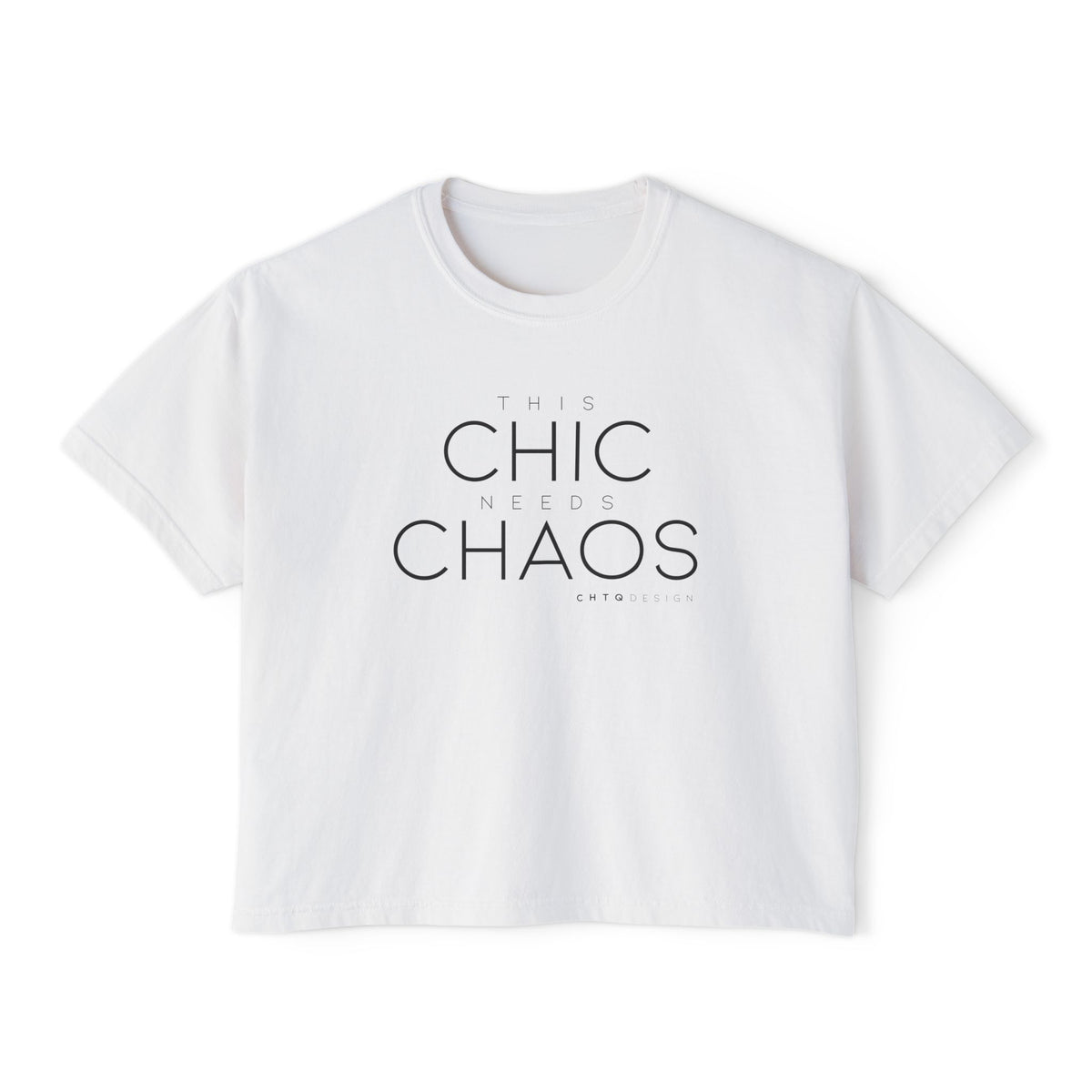 A white cropped graphic t-shirt with the text 'THIS CHIC NEEDS CHAOS' in black