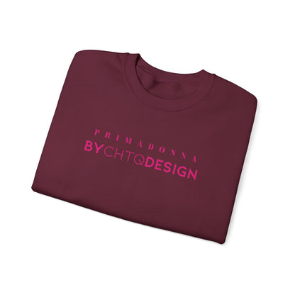 A folded maroon crewneck sweatshirt featuring pink “PRIMADONNA BY CHTQ DESIGN” text across the chest, displayed against a clean white background.