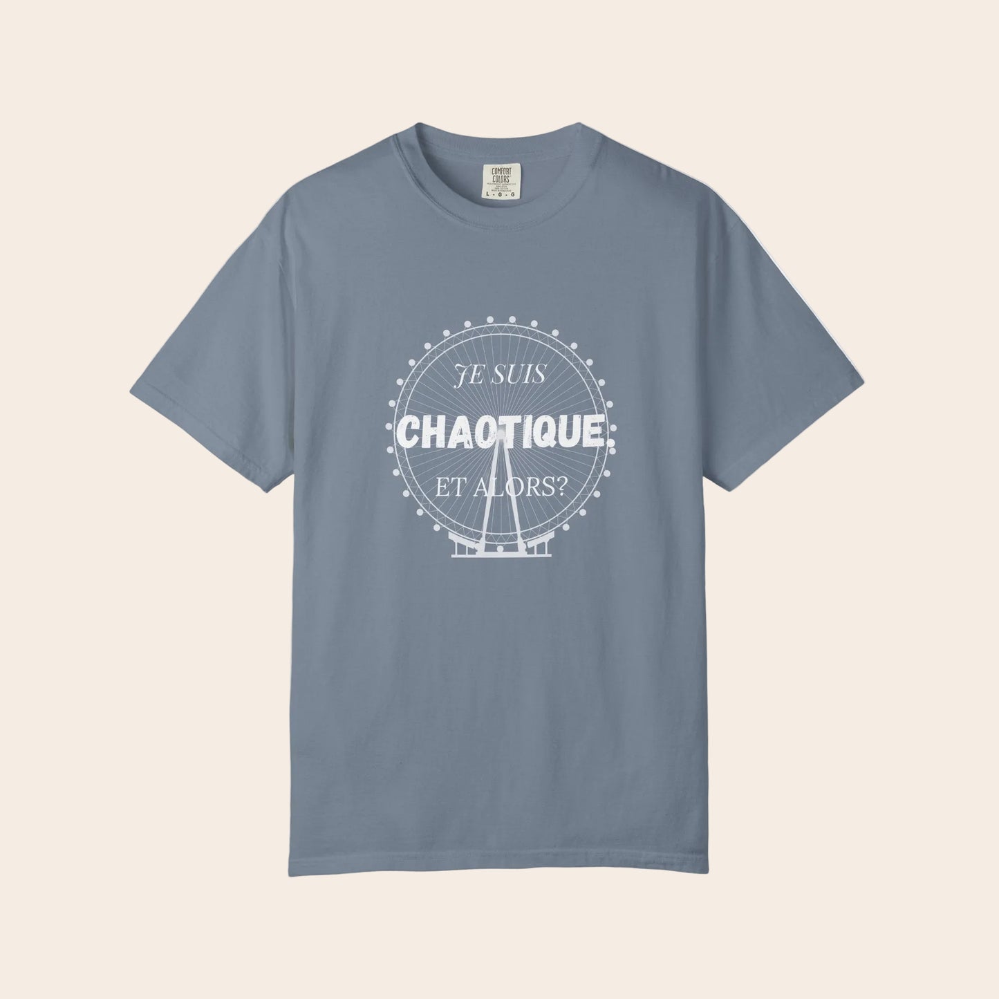 Blue jeans color t-shirt with 'Je Suis cahotique et Alors?' text on a white background