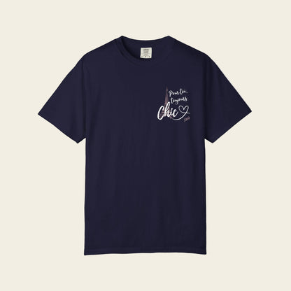 A navy blue short-sleeve crewneck t-shirt with a white graphic on the left chest reading 'pour toi toulours chic' with a heart silhouette, displayed on a clean white background.