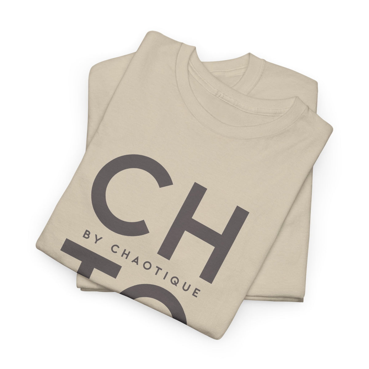 Folded beige CHTQ BY CHAOTIQUE graphic T-shirt featuring a dark gray typographic front print, displayed against a clean white background.