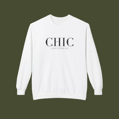 A white crewneck sweatshirt with 'CHIC' printed in black serif font and 'L'ART D'ETRE SOI' in smaller text below, displayed on a clean white background.