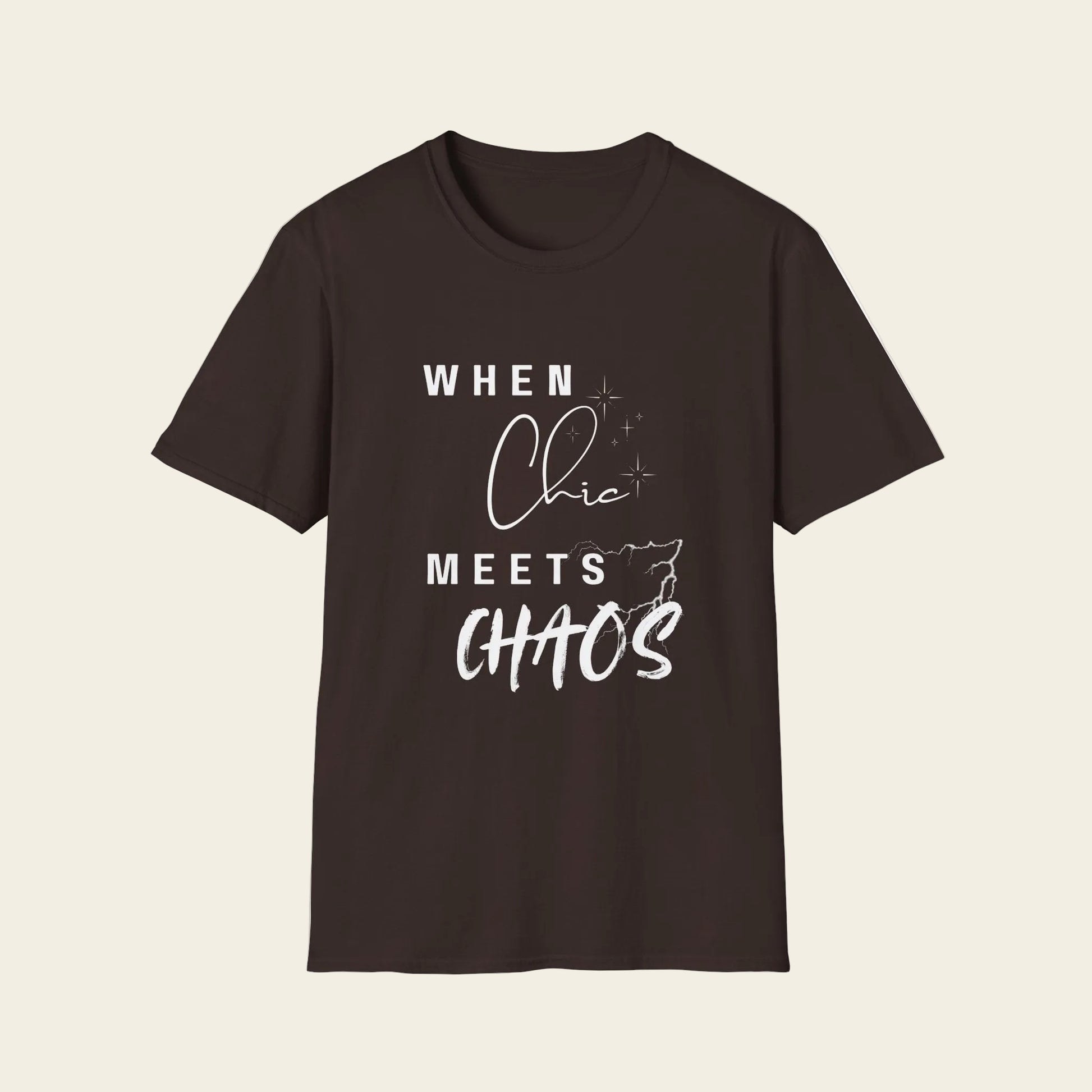 A dark brown short-sleeve crewneck t-shirt with a white graphic text print that reads 'WHEN Chic MEETS CHAOS' on the front, displayed against background.