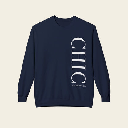 A black crewneck sweatshirt with a vertical white graphic print reading 'CHIC' and 'L'ART D'ETRE SCHIC' on the front, displayed against a solid white background.