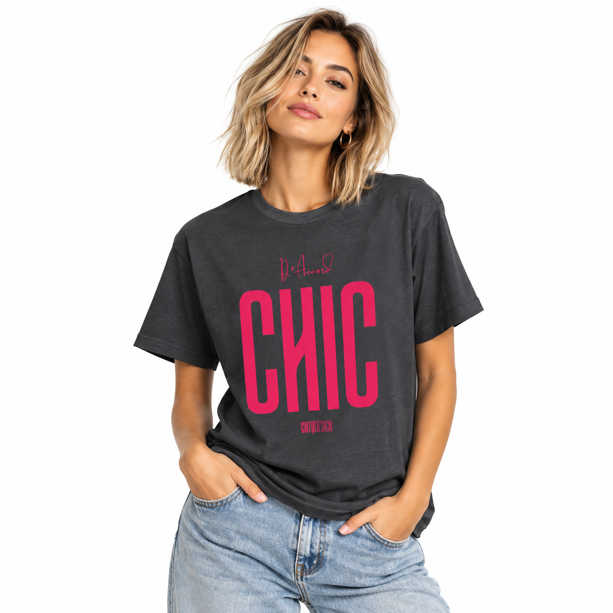 Young woman wearing a dark heather D’Accord CHIC graphic T-shirt with bold raspberry pink lettering and light blue jeans.