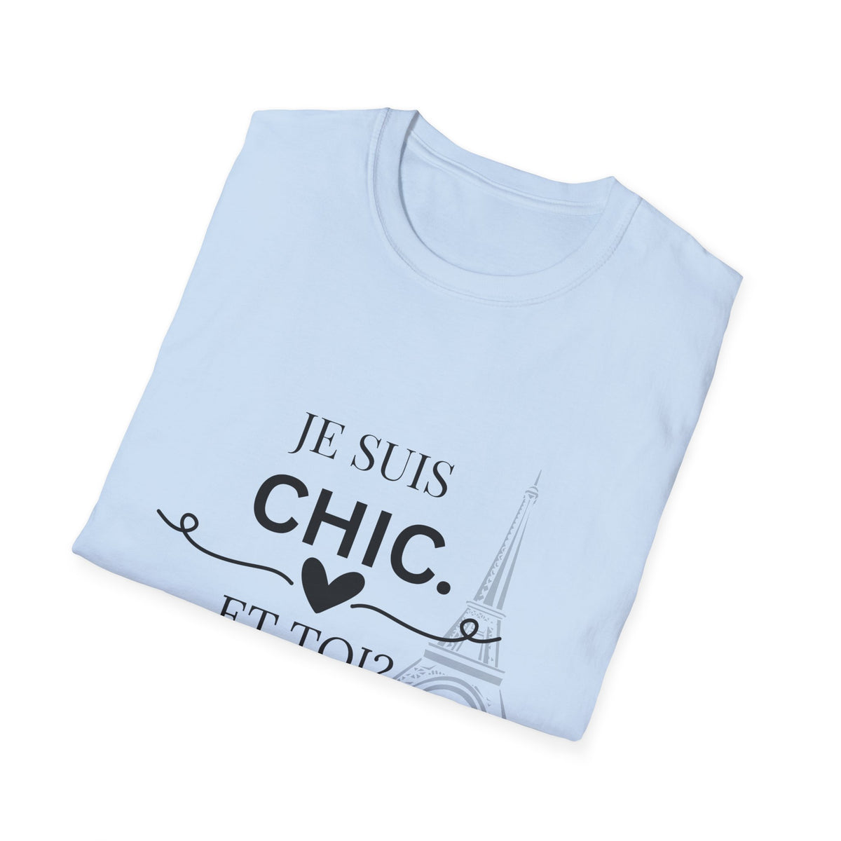 Folded light blue “Je Suis Chic. Et Toi?” graphic T-shirt with black text and an Eiffel Tower illustration, paired with light blue jeans against a light gray studio background.
