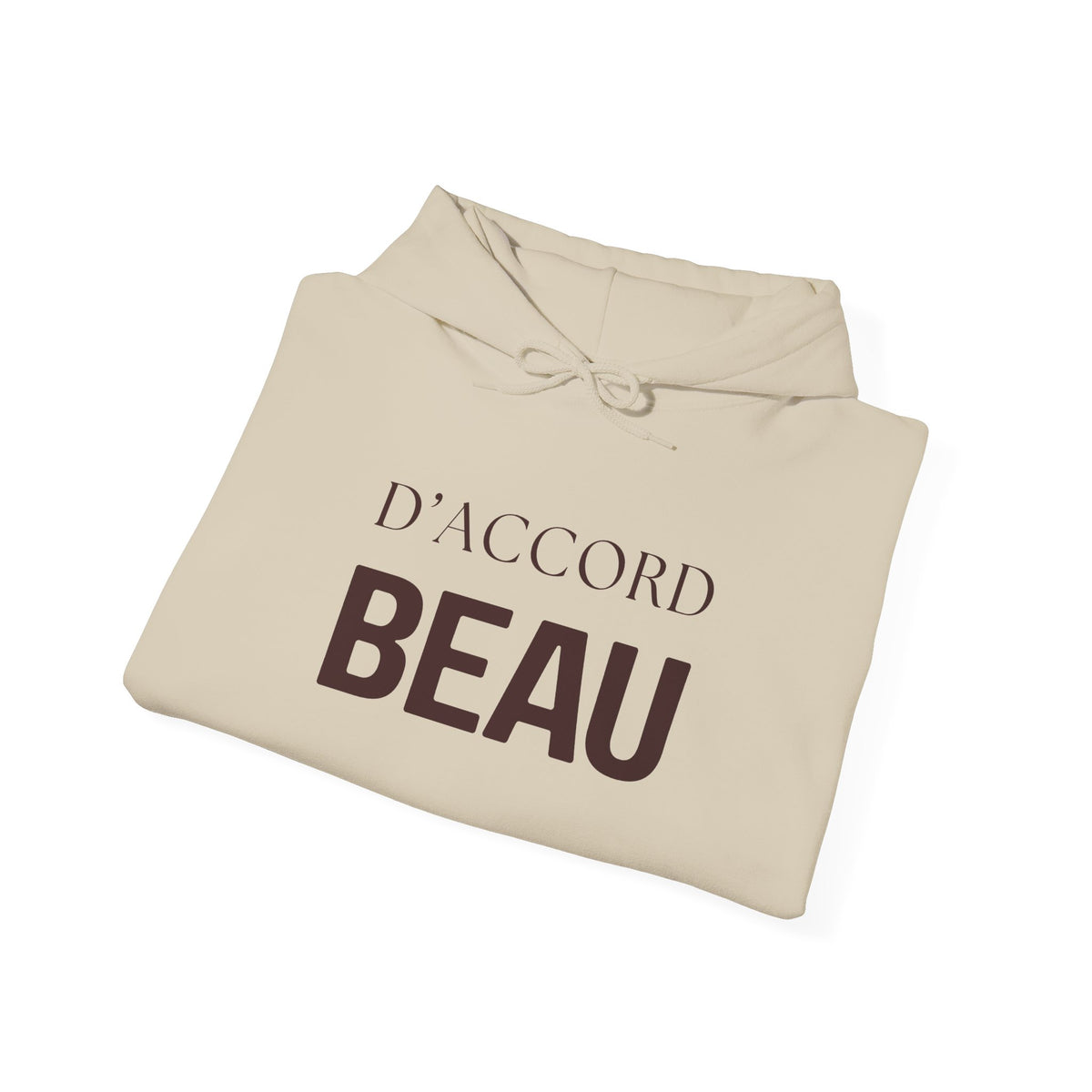A folded beige hoodie with a drawstring hood, featuring the French text 'D'ACCORD BEAU' printed on the front in dark brown, shown on a clean white background.