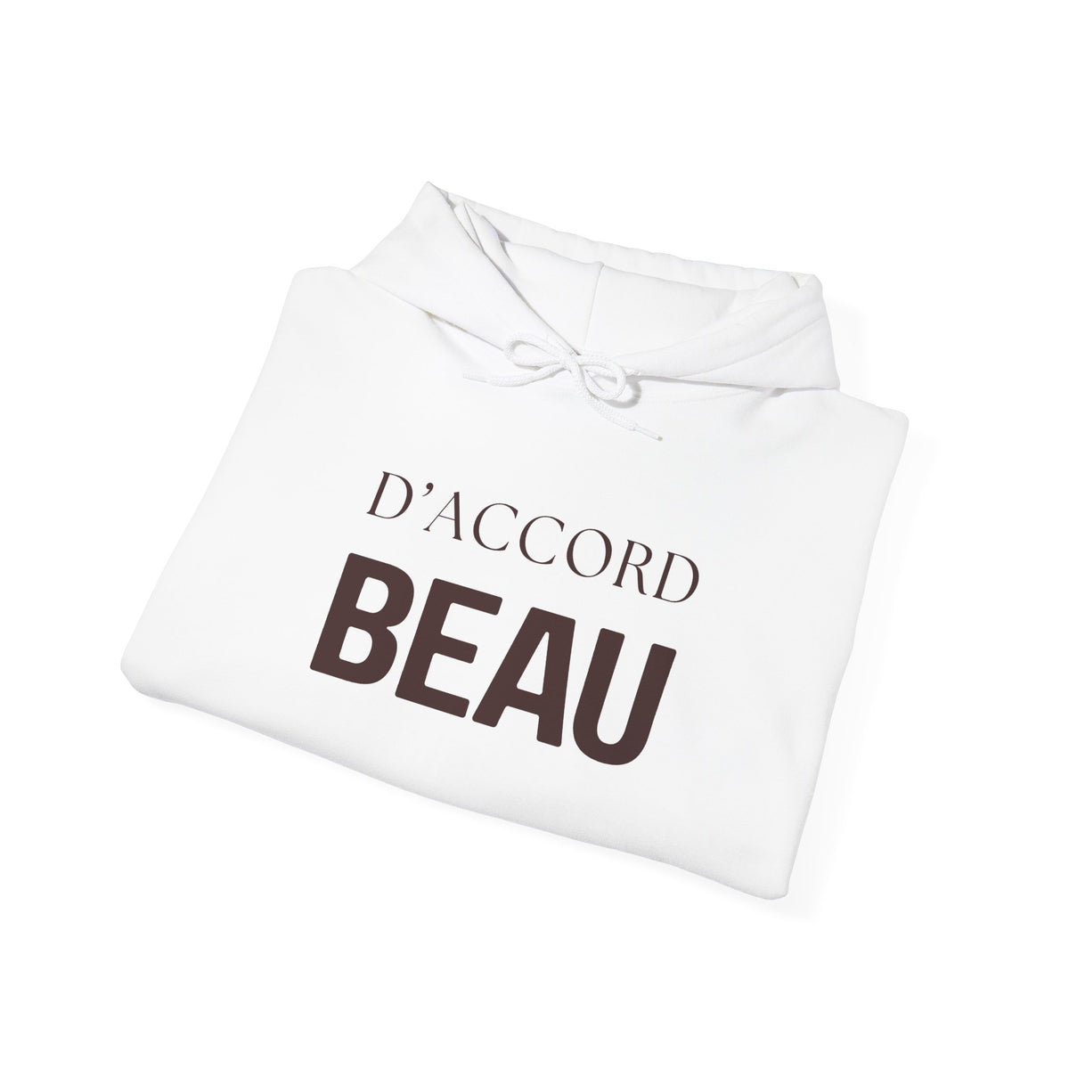 A folded white hoodie with a drawstring hood, featuring the French text 'D'ACCORD BEAU' printed on the front in dark brown lettering, set against a plain white background.