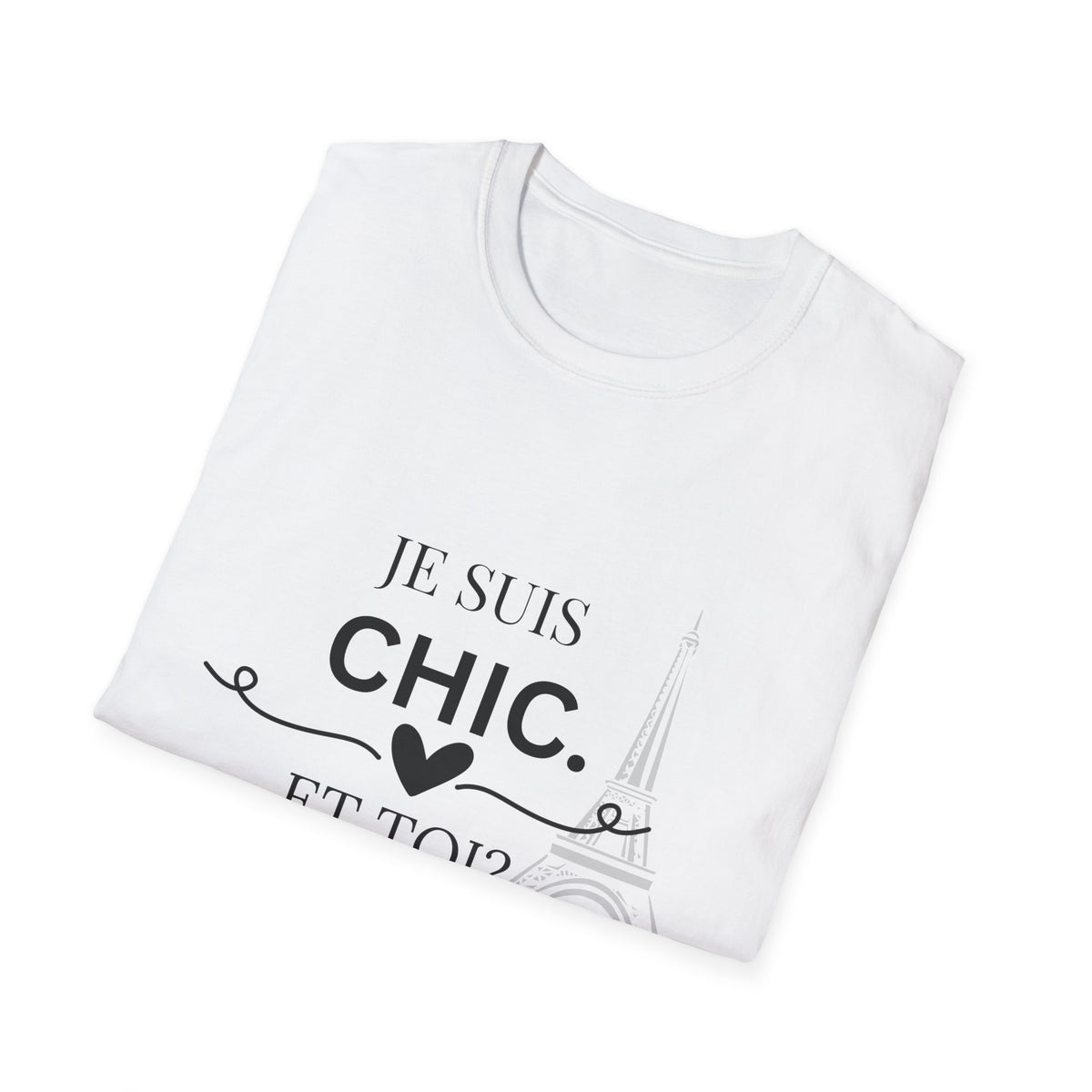 Folded white “Je Suis Chic. Et Toi?” graphic T-shirt with black text and an Eiffel Tower illustration, paired with light blue jeans against a light gray studio background.