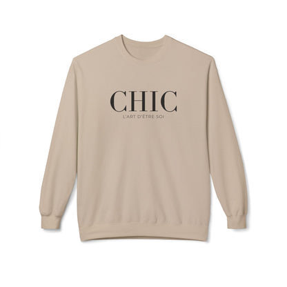 A sand color crewneck sweatshirt with 'CHIC' printed in black serif font and 'L'ART D'ETRE SOI' in smaller text below, displayed on a clean white background.