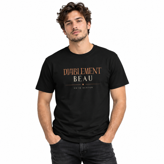A man wearing a black short-sleeve t-shirt with 'DIABLEMENT BEAU' printed in gold on the chest, paired with light beige pants, against a plain white background.