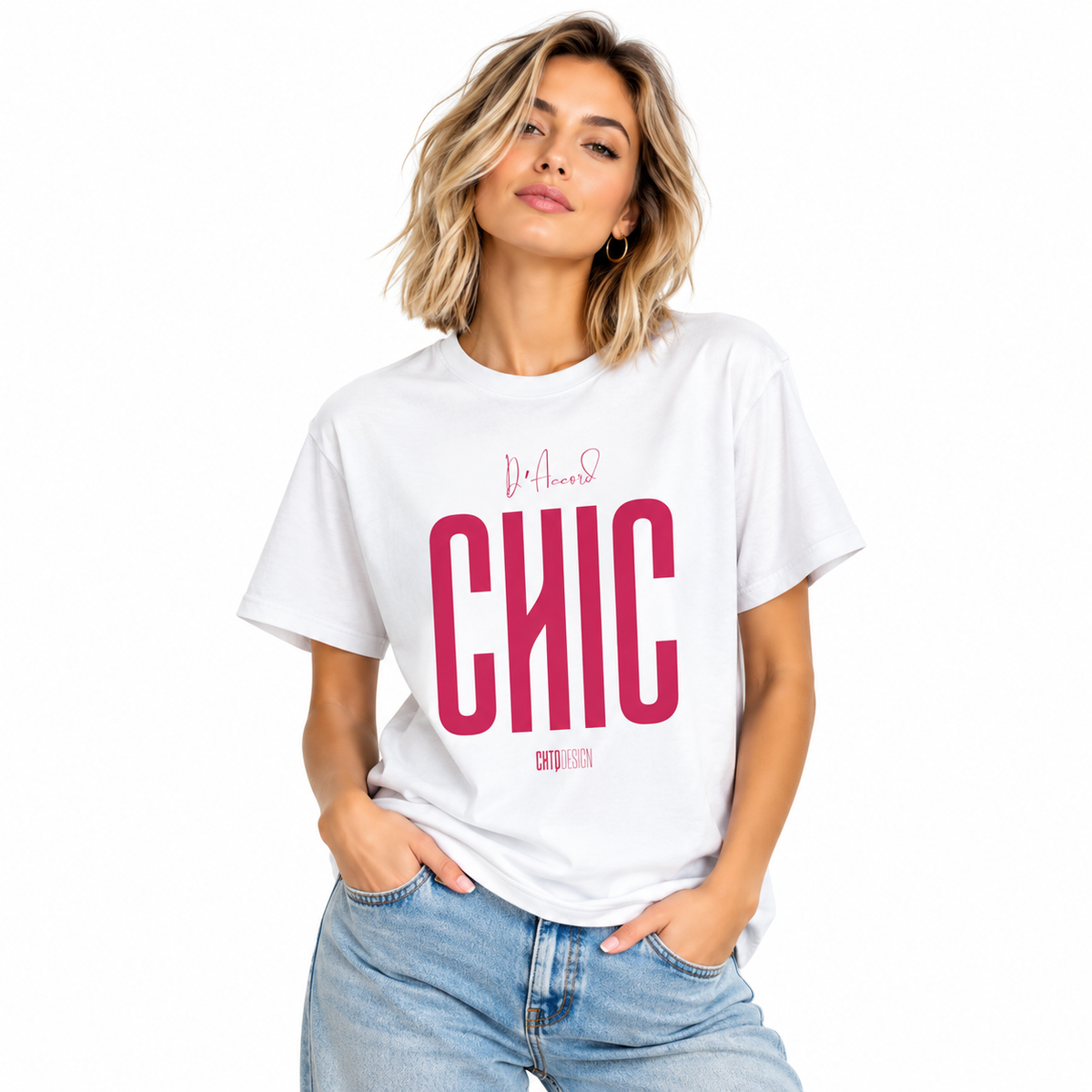 Young woman wearing a white D’Accord CHIC graphic T-shirt with bold raspberry pink lettering and light blue jeans.