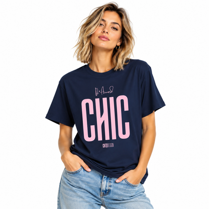 Young woman wearing a navy blue D’Accord CHIC graphic T-shirt with light pink lettering and blue jeans.