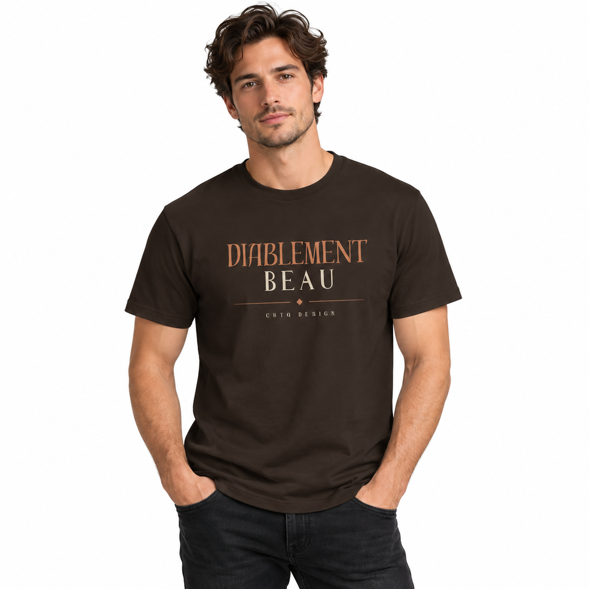 A man wearing a dark brown t-shirt with 'DIABLEMENT BEAU' printed on the chest in a copper and white font, paired with light beige pants, against a plain white background.
