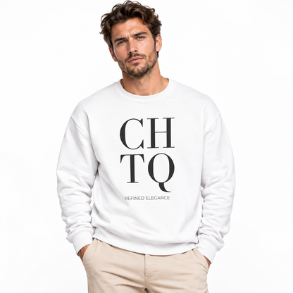 A man wearing a white crewneck sweatshirt with a bold black graphic print reading 'CHTQ' and 'REFINED ELEGANCE' on the front, paired with beige trousers, against a plain white background.