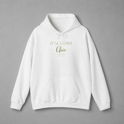 White D’Accord Chic pullover hoodie with metallic gold chest typography, drawstring hood and kangaroo pocket, displayed against a neutral grey studio background.
