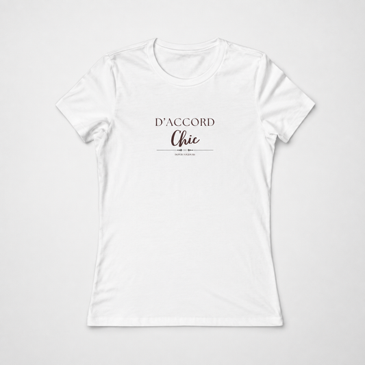 White short-sleeve crewneck T-shirt featuring the “D’Accord Chic” graphic in black and brown lettering on the front, displayed against a light gray background.