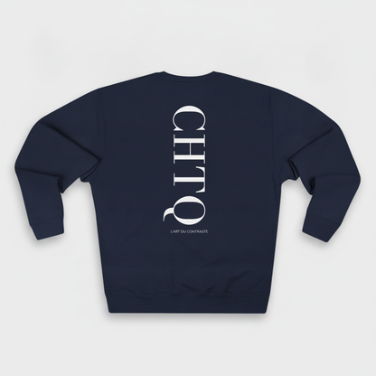 Navy blue crewneck sweatshirt with a large white vertical CHTQ graphic and L’Art du Contraste text on the back, displayed against a white background.