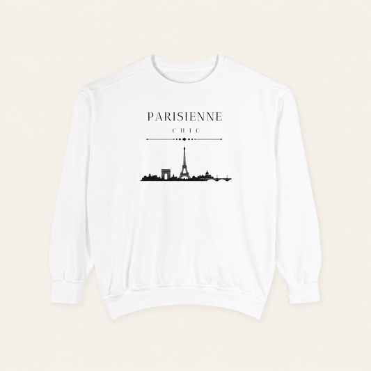 White crewneck sweatshirt featuring the “Parisienne Chic” graphic with a black Paris skyline on the front, displayed against a light beige background.