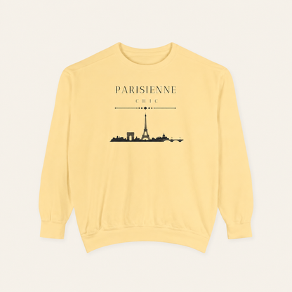 Butter color crewneck sweatshirt featuring the “Parisienne Chic” graphic with a black Paris skyline on the front, displayed against a light beige background.