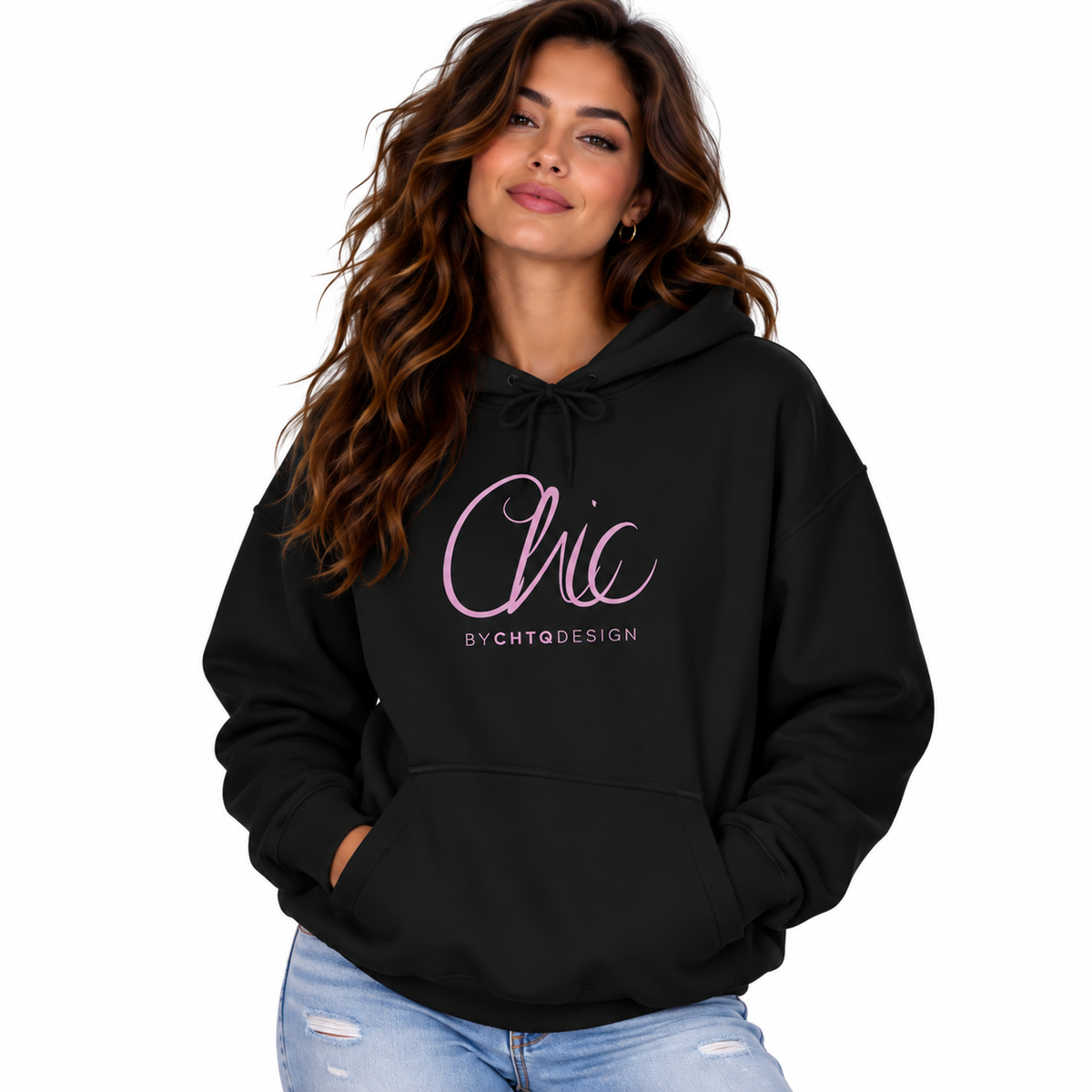 A woman wearing a black pullover hoodie with a pink 'Chic' graphic and 'BY CHTQ DESIGN' text on the front, paired with light blue jeans, against a plain white background.