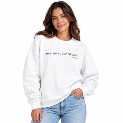 A woman wearing a white crewneck sweatshirt with 'DESIGNED OUT OF LINE by CHTQ' printed in black across the chest, paired with light blue jeans, against a plain white background.