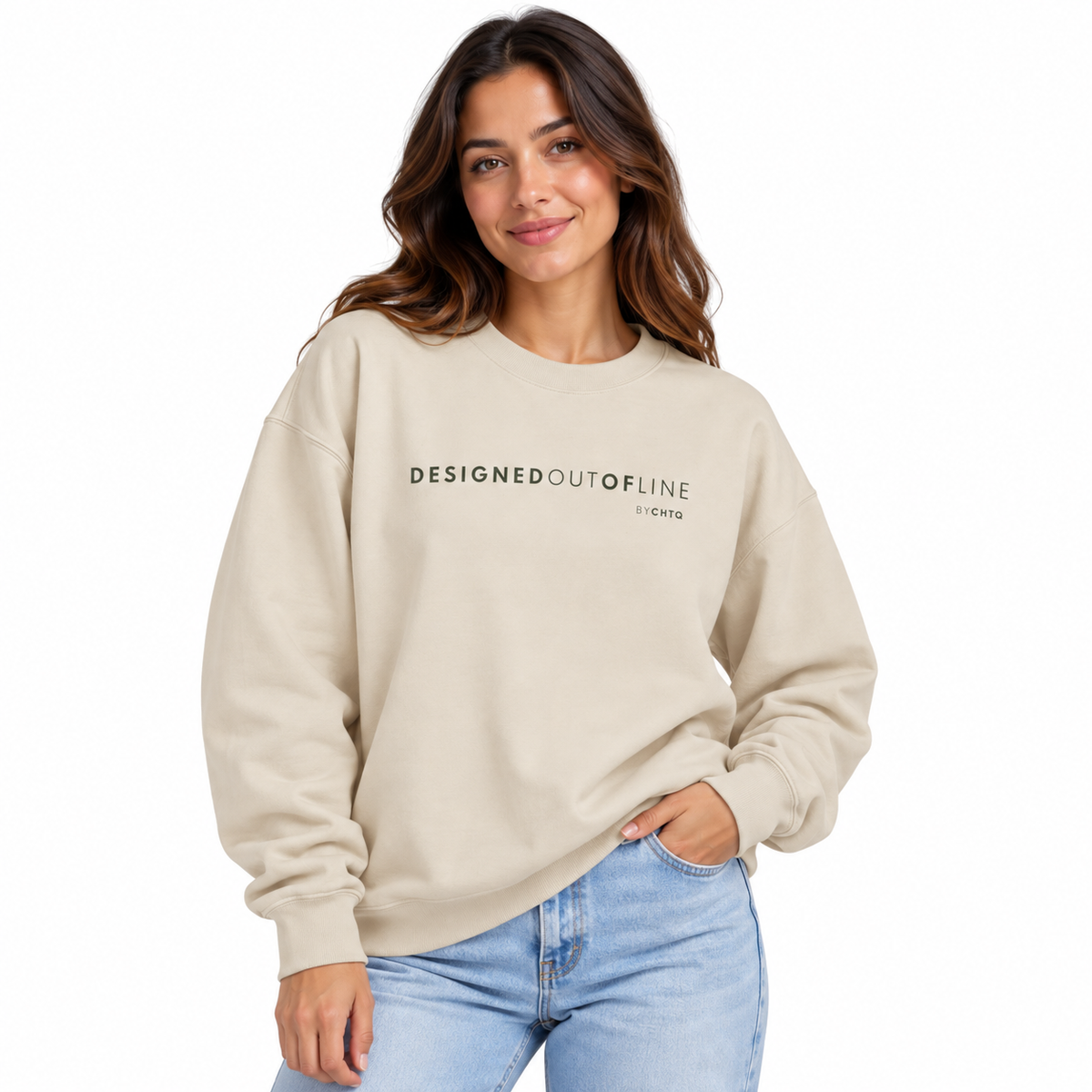 A woman wearing a beige crewneck sweatshirt with 'DESIGNED OUT OF LINE by CHTQ' printed in black across the chest, paired with light blue jeans, against a plain white background.